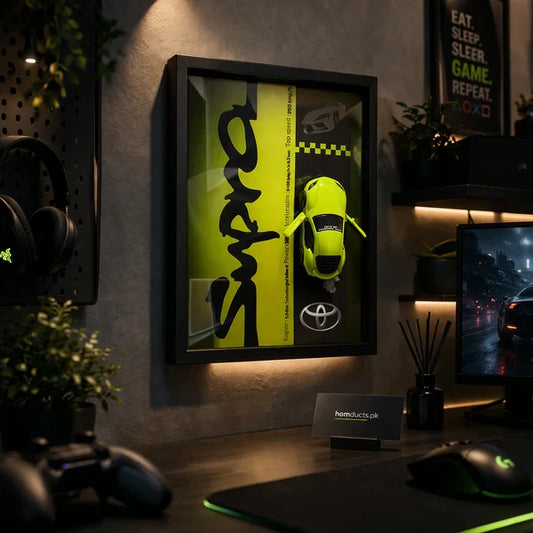 Luxury 3D Car Frame Wall Art – Premium Gaming Room Decor Display with Mini Sports Car. Neon green toy car in a frame on a wall above a desk with gaming equipment.