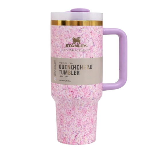 LoveShack Fancy Stanley 40oz floral stainless steel tumbler with handle and straw. Pink speckled tumbler with purple handle and lid on a white background