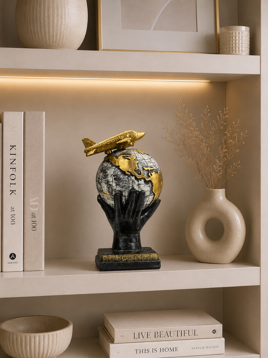 World Globe with Airplane Statue